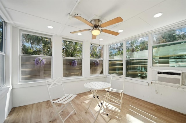 unfurnished sunroom with ceiling fan and cooling unit