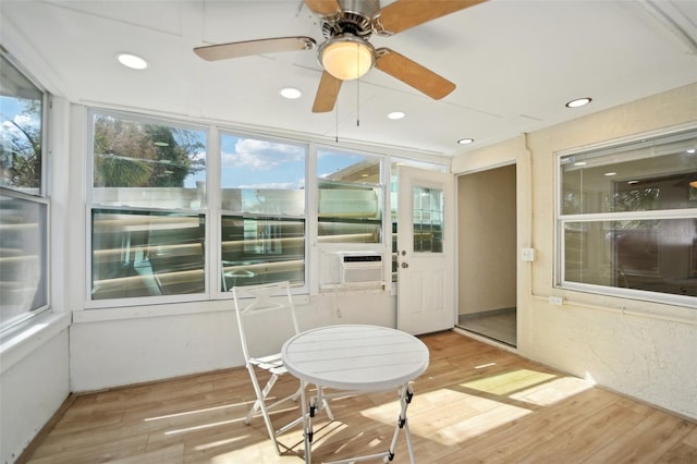 sunroom with ceiling fan and cooling unit