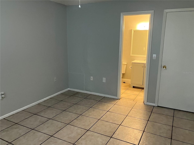 empty room with light tile patterned floors