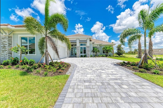 mediterranean / spanish-style house with a front yard