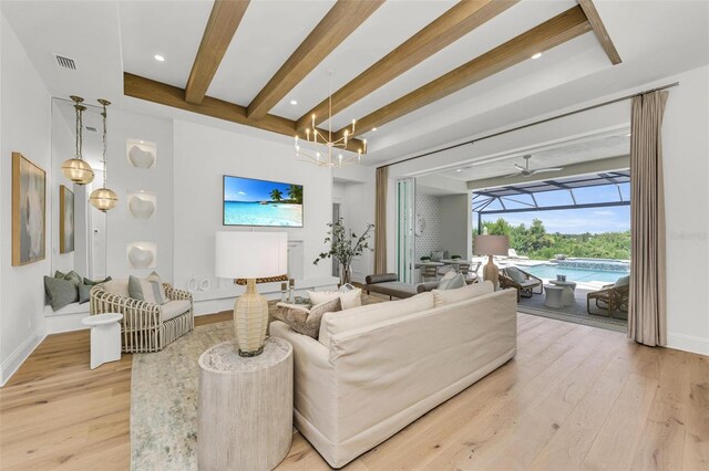 living room with light hardwood / wood-style flooring and beam ceiling