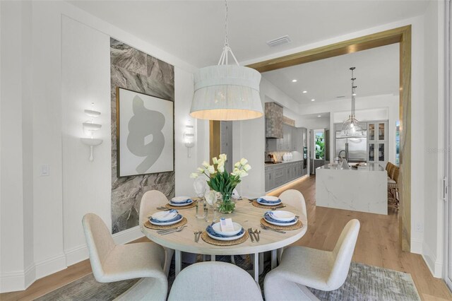 dining space featuring light hardwood / wood-style floors