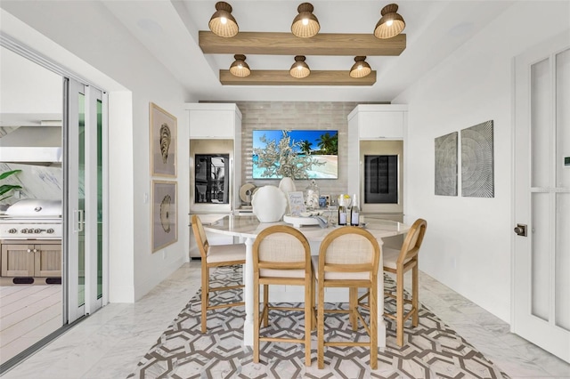 dining area featuring a raised ceiling