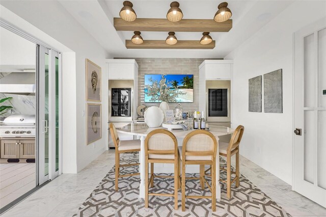 dining area featuring a raised ceiling