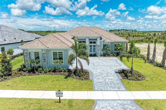 ranch-style home featuring a front yard