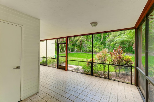 unfurnished sunroom with plenty of natural light