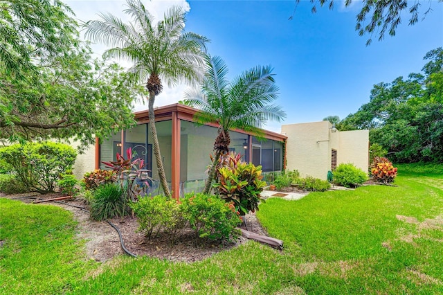 view of yard with a sunroom