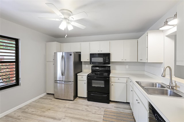 kitchen with sink, black appliances, light wood-type flooring, ceiling fan, and white cabinets