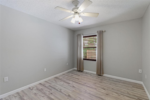 unfurnished room with ceiling fan, a textured ceiling, and light hardwood / wood-style floors