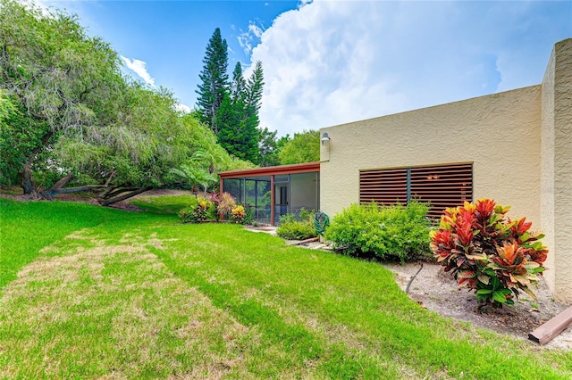 view of yard with a sunroom