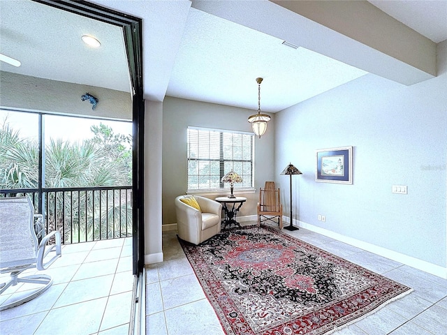 sitting room featuring visible vents, baseboards, and light tile patterned floors