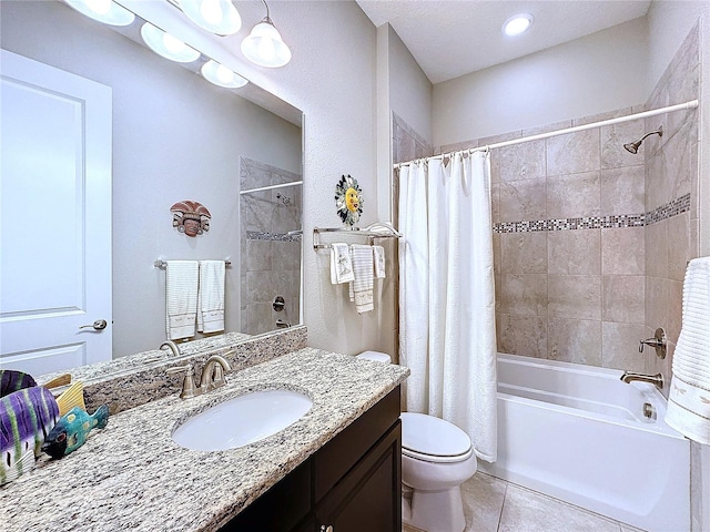 full bath with shower / tub combo with curtain, vanity, toilet, and tile patterned floors