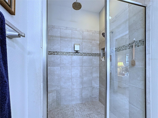 full bath with a shower stall