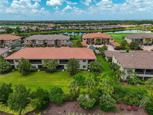 bird's eye view with a water view and a residential view