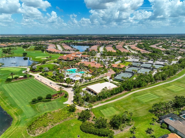 drone / aerial view featuring a water view and golf course view