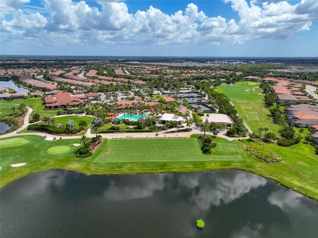 birds eye view of property with a water view and golf course view