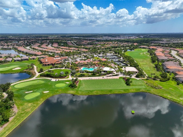 birds eye view of property featuring view of golf course and a water view