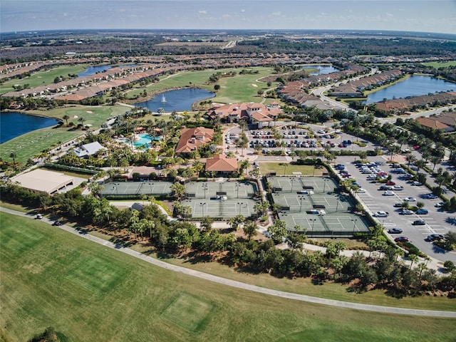 birds eye view of property featuring a water view and golf course view