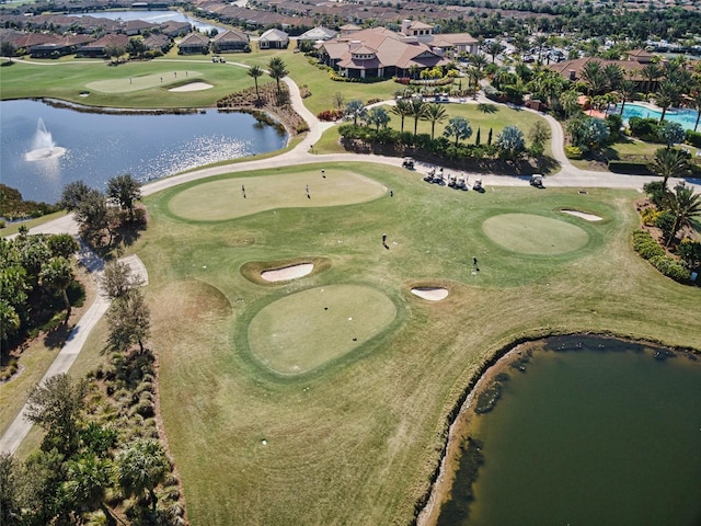 birds eye view of property with a residential view, a water view, and golf course view