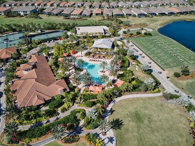 drone / aerial view with a residential view and a water view