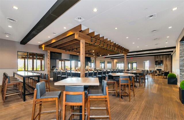 dining room with wood finished floors and visible vents