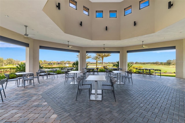 view of patio / terrace with outdoor dining area and a ceiling fan