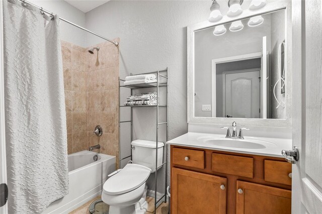 full bathroom with toilet, vanity, and shower / tub combo with curtain