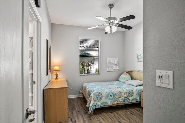 bedroom featuring wood-type flooring and ceiling fan