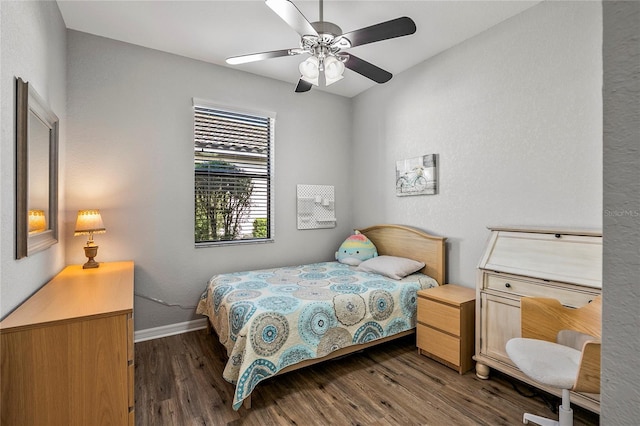 bedroom featuring ceiling fan and dark hardwood / wood-style flooring