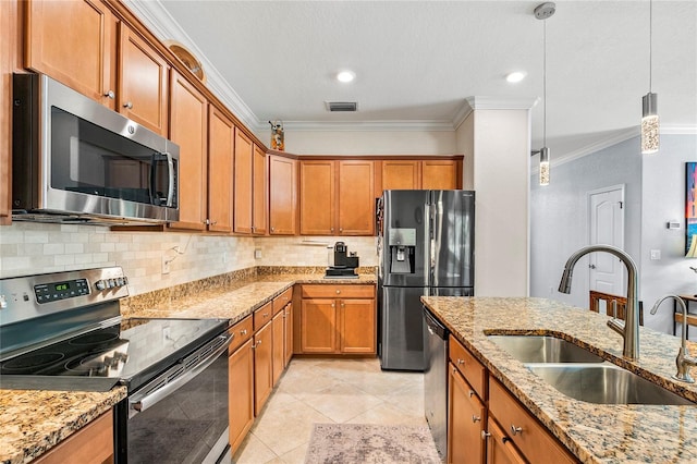 kitchen with sink, ornamental molding, decorative light fixtures, light stone counters, and stainless steel appliances