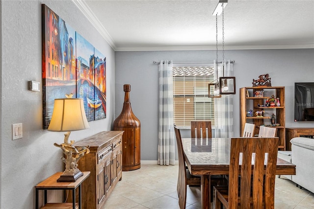 dining room with crown molding, light tile patterned floors, and a textured ceiling