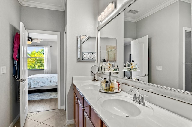 bathroom featuring crown molding, tile patterned flooring, vanity, and ceiling fan