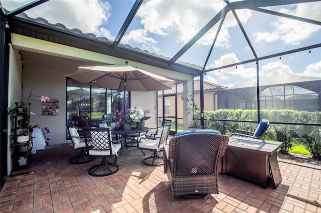 view of patio with glass enclosure