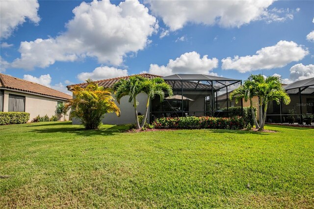 view of yard with a lanai