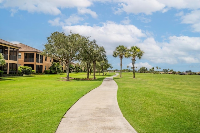 view of home's community featuring a lawn