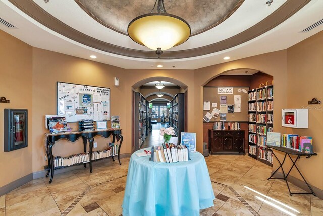 dining area featuring a raised ceiling