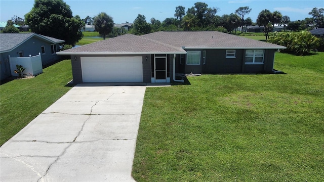 ranch-style house with a front lawn and a garage