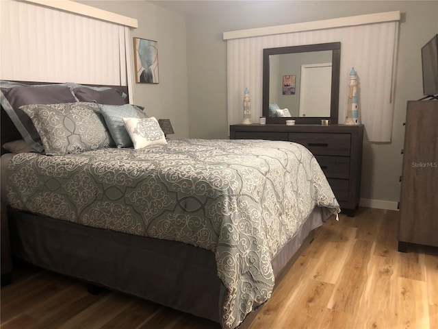 bedroom with light hardwood / wood-style flooring