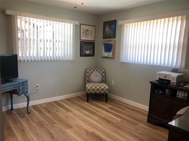 sitting room featuring light wood-style floors and baseboards