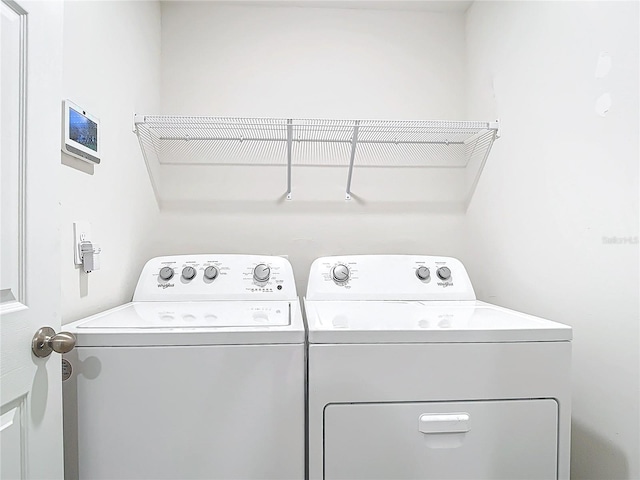 laundry room with independent washer and dryer