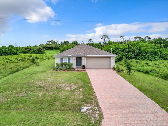 single story home featuring decorative driveway, an attached garage, a front lawn, and stucco siding