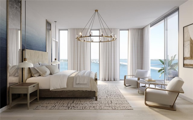 bedroom with a wall of windows, a notable chandelier, and wood finished floors