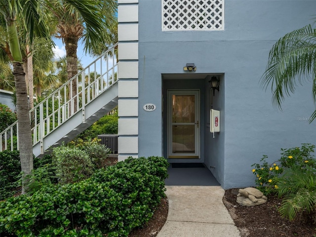 doorway to property featuring cooling unit