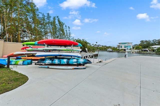 exterior space featuring a water view and a boat dock