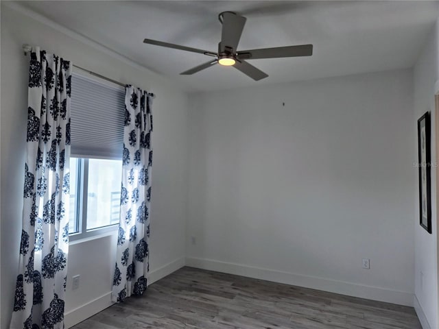 empty room featuring ceiling fan and light wood-type flooring