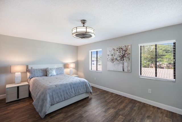 bedroom featuring dark hardwood / wood-style flooring