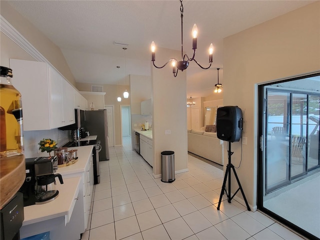 kitchen featuring decorative light fixtures, stainless steel dishwasher, white cabinets, and light tile patterned floors