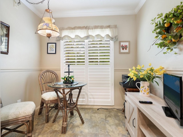 dining area featuring ornamental molding