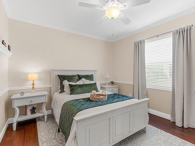 bedroom featuring crown molding, ceiling fan, and dark hardwood / wood-style floors