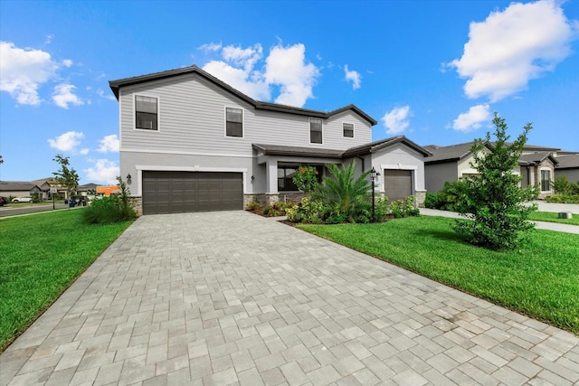 view of front of house with a garage and a front yard